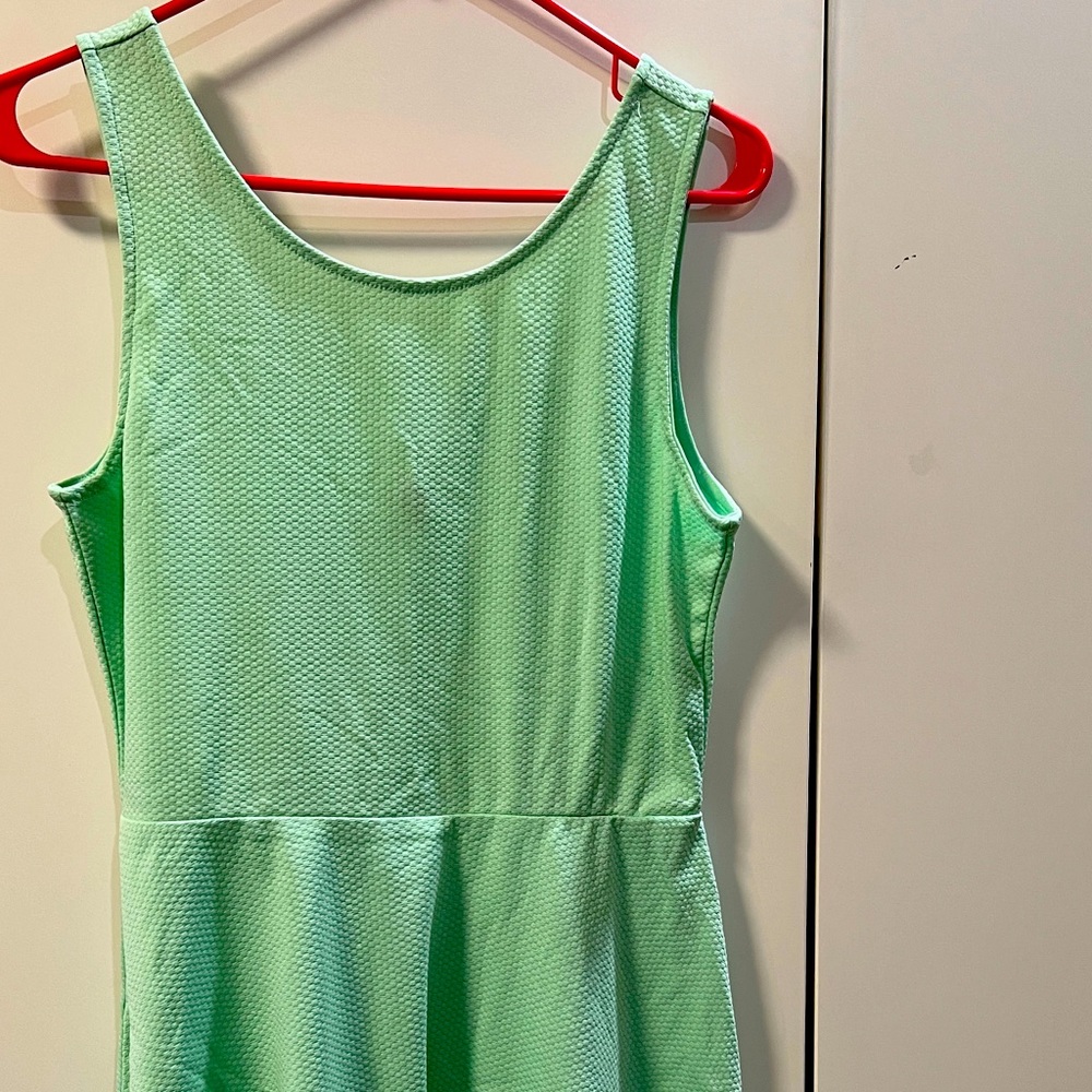 Dress mid length. Pastel green, textured fabric. Size L